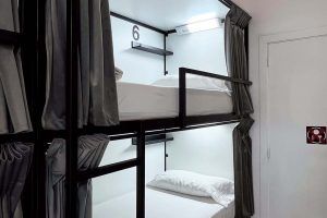 Interior view of a 6-bed shared room with shared bathroom at Way Hostel Madrid