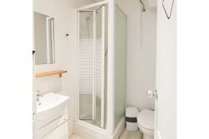 Modern private bathroom in a 6-bed shared room at Way Hostel Madrid
