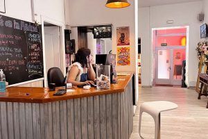 Receptionist at Way Hostel Madrid, welcoming guests and providing information about activities
